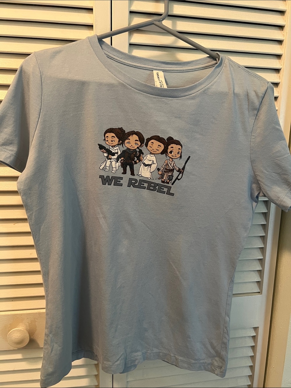 #2234**Light Blue 'We Rebel' Graphic Tee - Picture 1 of 13